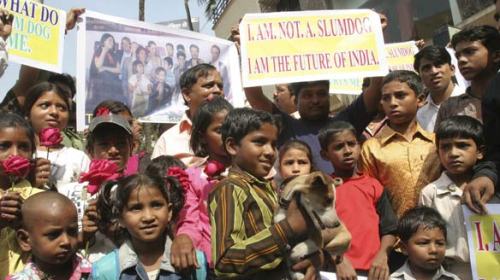 Residents of a Mumbai slum show their displeasure over the name of the hit film Slumdog Millionaire in a protest outside the office the film's co-star, Anil Kapoor.